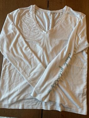Beyond Yoga White Long Sleeve Lace Back Top with Teal Script on Sleeve
